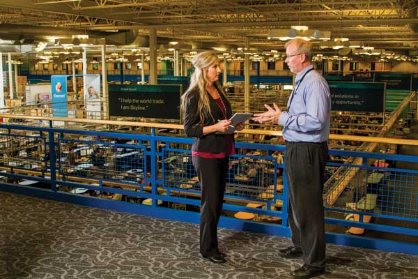 Dakota Electric business account executive talking with a member